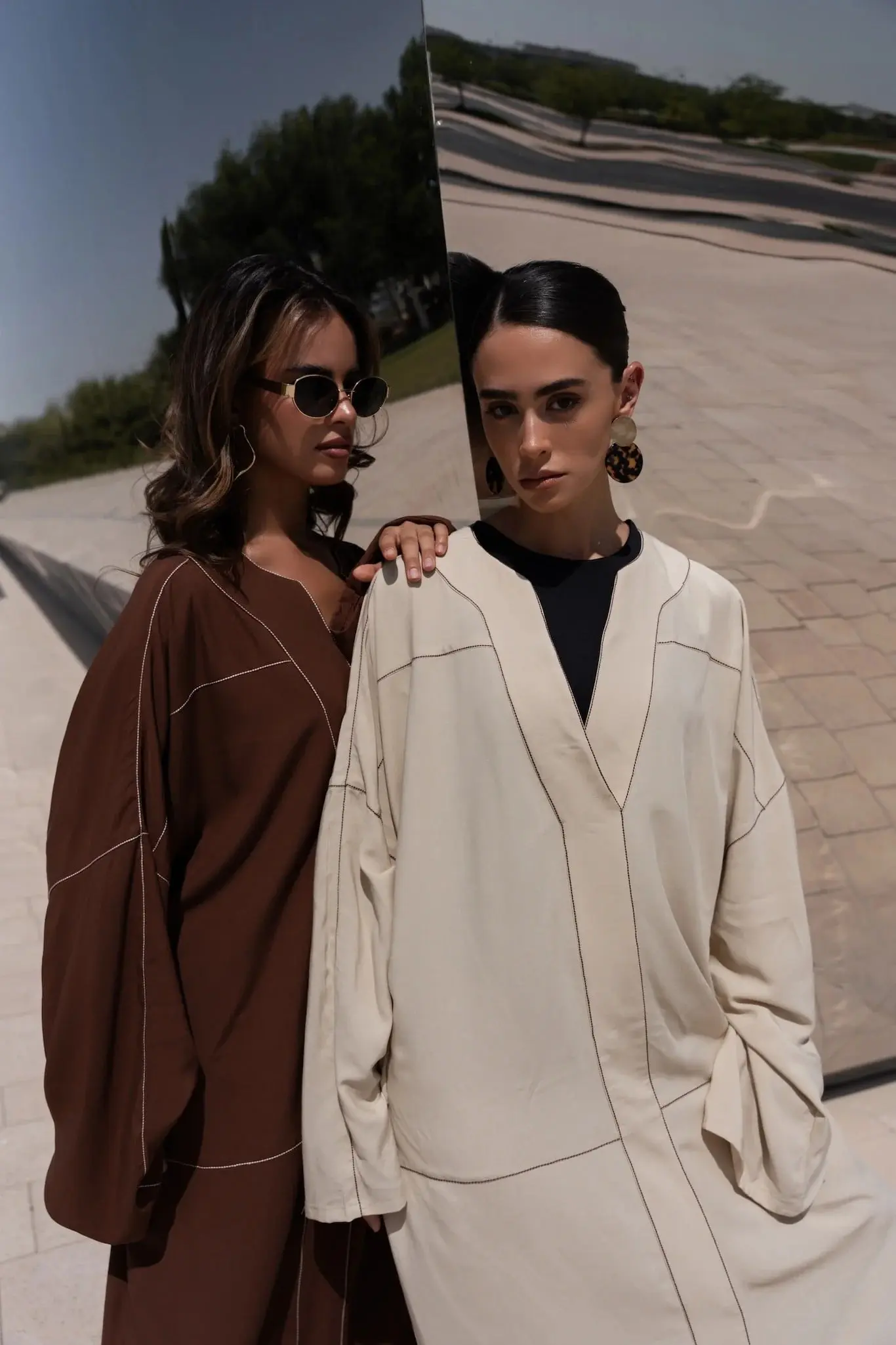 Two models wearing SoHa Living linen outfits